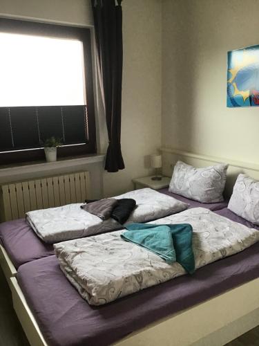 Ένα ή περισσότερα κρεβάτια σε δωμάτιο στο Haus Dünenblick