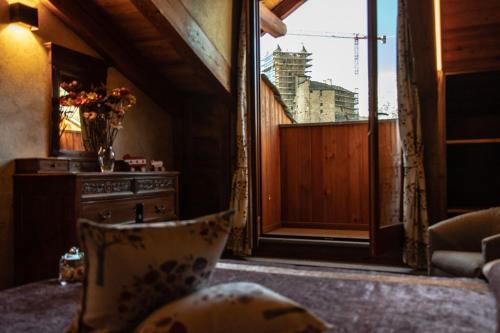 a living room with a chair and a window at Wine-Farm La Source in Saint-Pierre