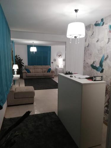 a living room with a couch and a table at A Casa De Amparo in Sanxenxo