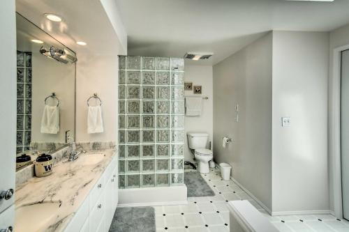 a bathroom with two sinks and a toilet and a shower at Spacious Family Home on Golf Course Hike and Bike! in Bremerton