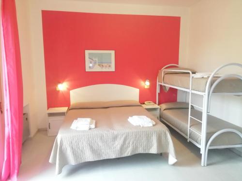 Postel nebo postele na pokoji v ubytování Hotel Rita
