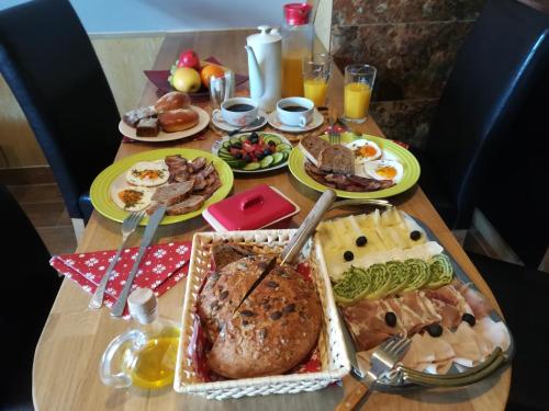 a table with a turkey and other food on it at Apartmán Life in Nature in Jaronice