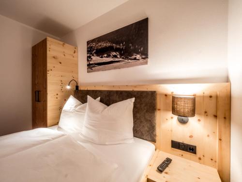 Ліжко або ліжка в номері Almhittn - Luxus Appartements