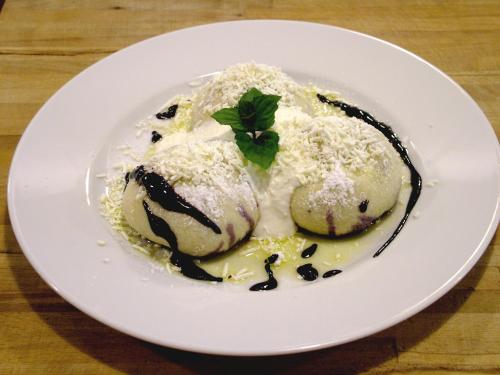 a plate of food with ice cream and a green leaf at ProFamily Hotel TOP Benecko in Benecko