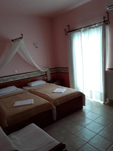 
Un pat sau paturi într-o cameră la Nepheli
