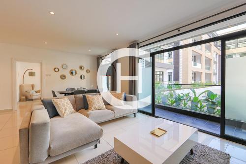 a living room with a couch and a table at Embassy Gardens by Clifton Homes in Accra