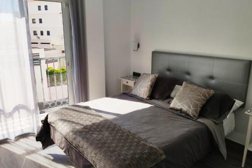 Postel nebo postele na pokoji v ubytování Apartamentos Gran Plaza De Nerja
