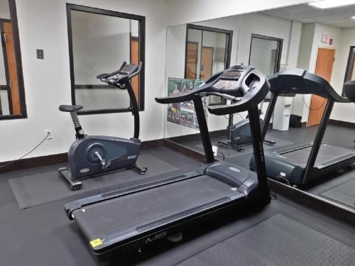 a gym with two exercise bikes and a treadmill at Wingate by Wyndham Bowling Green in Bowling Green