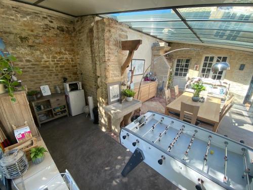 an overhead view of a room with a ping pong table at Le mas Normand in Ver-sur-Mer