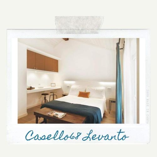 a bedroom with a bed and a table at Casello68 in Levanto