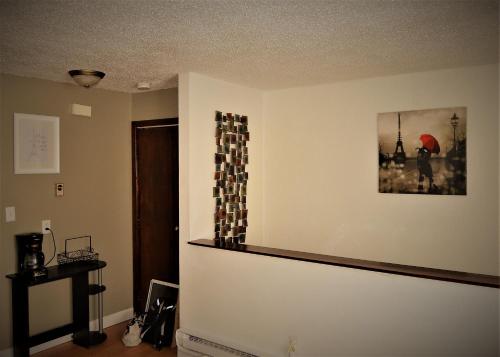 a room with a wall with a picture on the wall at Urbana in Grand Forks
