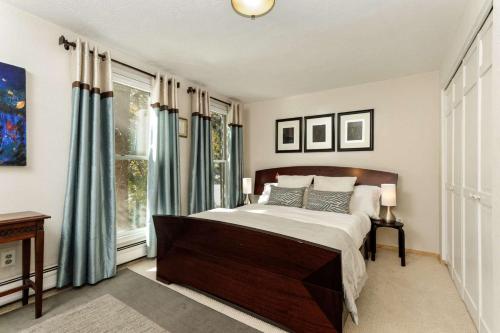a bedroom with a bed and a large window at Sagewood 8 in Aspen