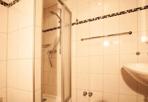 a bathroom with a shower and a sink at Haus 4 Montafon by Pferd auf Wolke in Gaschurn