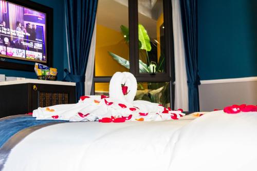 Postel nebo postele na pokoji v ubytování Michi's hotel laocai
