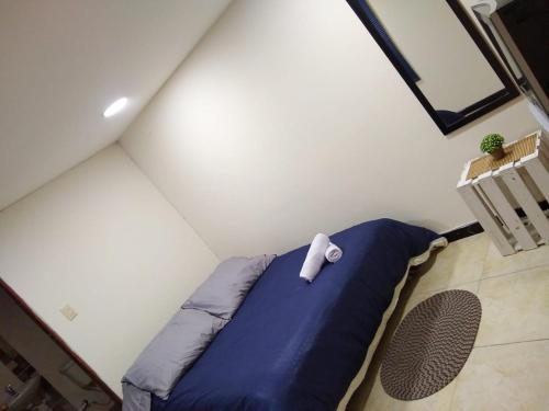 Tempat tidur dalam kamar di Hospedaje Room's El Dorado