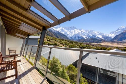 a balcony with a view of the mountains at The Hermitage Hotel Mt Cook in Mount Cook Village