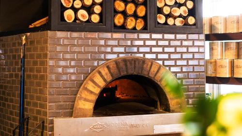 a brick oven with a bunch of donuts in it at Casa Boutique Hotel in Miami Beach