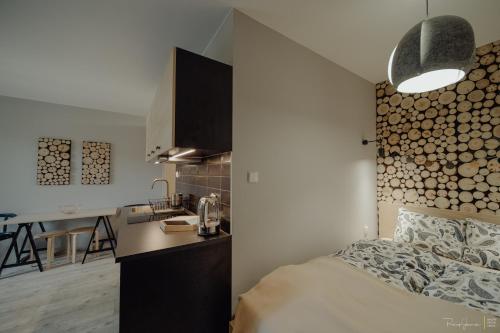 Ein Bett oder Betten in einem Zimmer der Unterkunft Apartamenty Silence Górskie Zacisze
