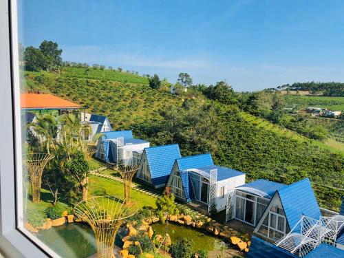 an aerial view of a house with blue roofs at Homestay Tulip Garden Bảo Lộc in Bao Loc