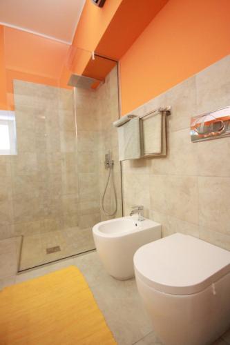 a bathroom with a toilet and a shower at Apartment Villa Mandria in Opatija