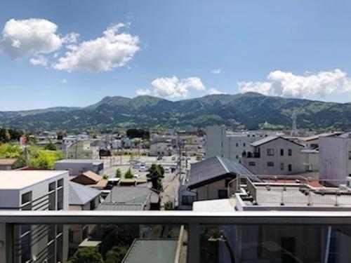 a view of a city from the balcony of a building at Fuji Gotemba Condominium Tannpopo in Gotemba