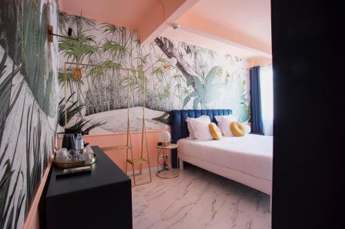 Cama o camas de una habitación en Hôtel Mademoiselle