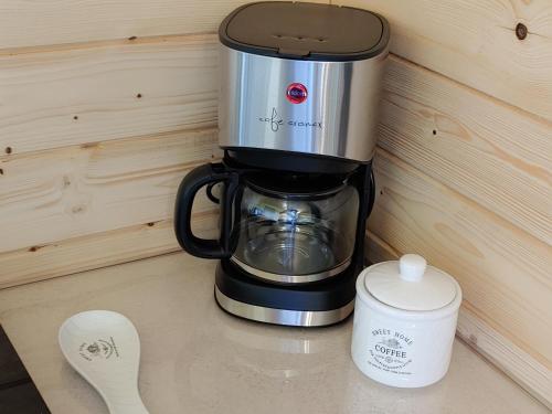 a coffee maker sitting on top of a counter at Apartamenty przy Jeziorze Żywieckim z widokiem na Skrzyczne in Żywiec