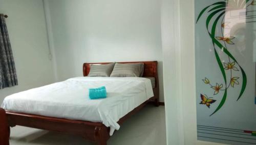 Ένα ή περισσότερα κρεβάτια σε δωμάτιο στο WISET SABAI RESORT