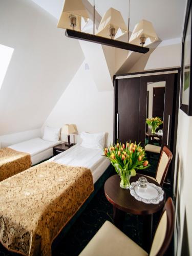 Postel nebo postele na pokoji v ubytování Hotel Zamek Gniew
