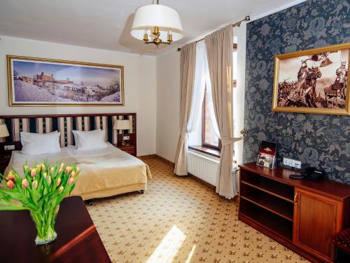 Postel nebo postele na pokoji v ubytování Hotel Zamek Gniew