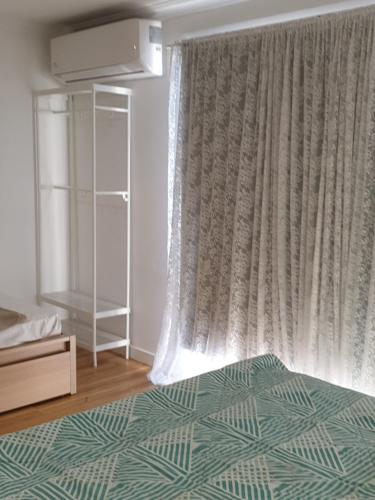 DIANELLA Budget Rooms Happy Place to Stayにあるベッド