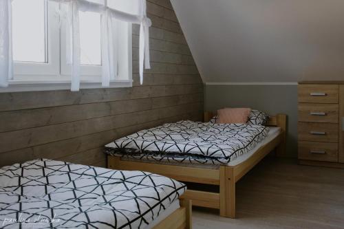 Кровать или кровати в номере Bobrowe Zacisze - domki letniskowe