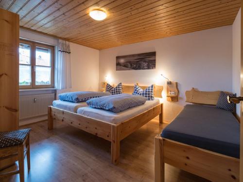 Ένα ή περισσότερα κρεβάτια σε δωμάτιο στο Ferienhaus Bach Gotthard