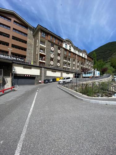 an empty street in front of a building at P&C Ribasol in Arinsal
