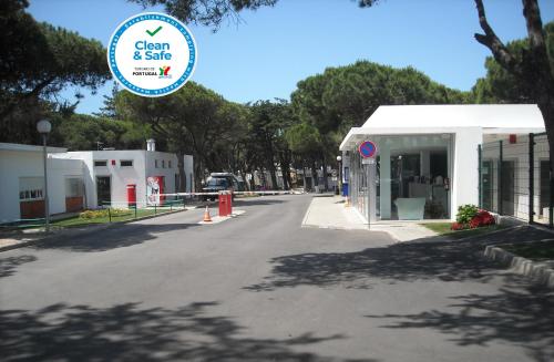 a street with a sign that says open and safe at Parque De Campismo Orbitur Guincho in Cascais