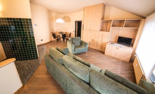 a living room with a couch and a table at Appartamenti Pirovano Bormio in Bormio
