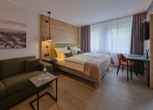 Säng eller sängar i ett rum på Hotel Restaurant Burg-Klause