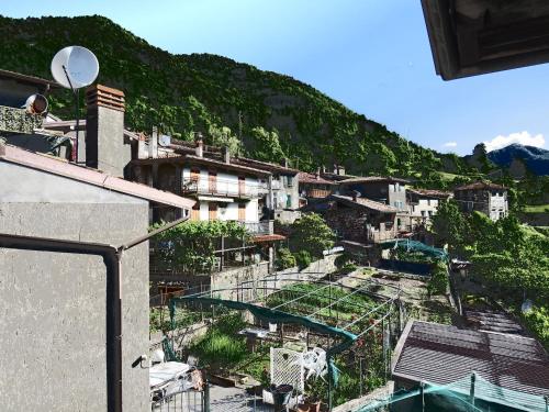 a view of a city with buildings on a hill at Locanda Genzianella in Gargnano