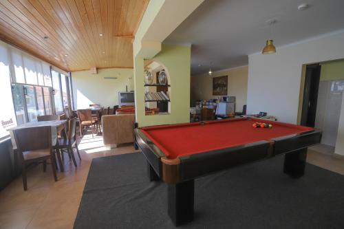 a living room with a pool table in it at Resedencial centro in Vimioso