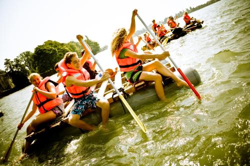 a group of people on a raft in the water at HI Youth Hostel Lindau in Lindau