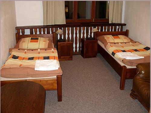 Postel nebo postele na pokoji v ubytování Penzion U Karásků