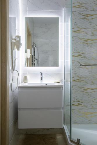 Ванная комната в barasport city apartments
