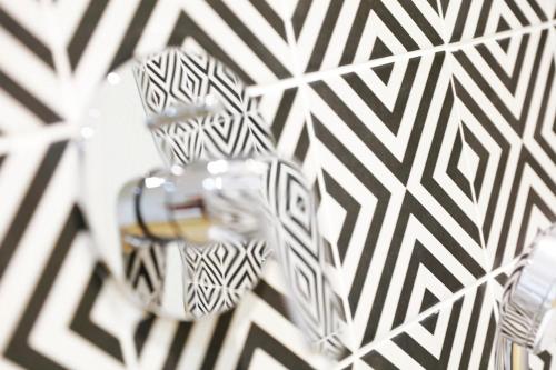 a black and white patterned wall with a engagement ring at Hues - Castle Cary in Castle Cary