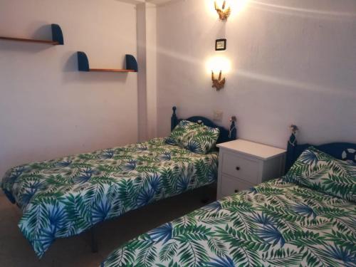 Postel nebo postele na pokoji v ubytování Calle Quinta, 3