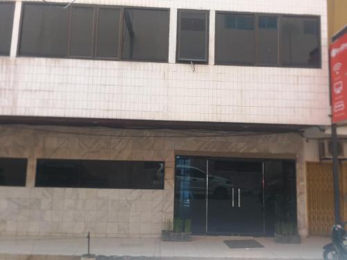 a building with a car parked inside of it at Hotel Mayang Sari 1 in Jambi