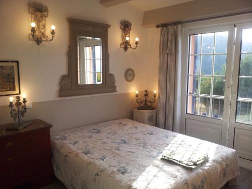 En eller flere senge i et værelse på Villa Primavera