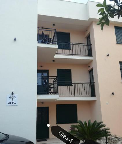 an external view of a building with balconies at Olea in Tivat