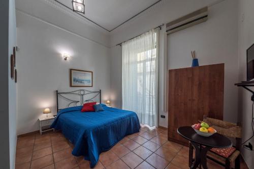 A bed or beds in a room at 'Na Siesta