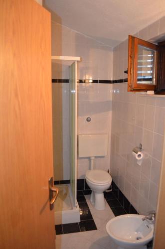 a bathroom with a toilet and a sink at Holiday Villa in Omiš in Omiš