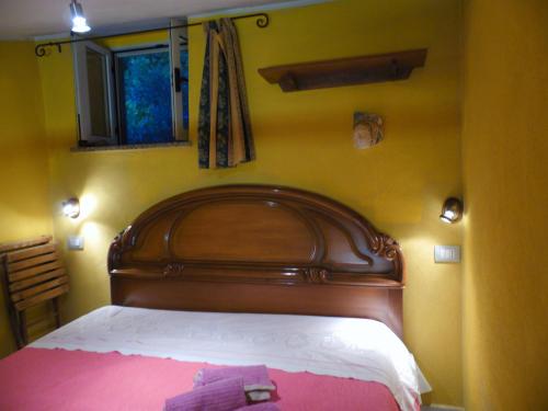 Ein Bett oder Betten in einem Zimmer der Unterkunft Villetta I Ciliegi